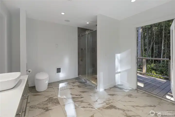 A beautifully updated tile bath offers a spa-inspired retreat with modern finishes, a walk-in shower, and direct access to the surrounding natural setting. A beautifully updated tile bath offers a spa-inspired retreat with modern finishes, a walk-in shower, and direct access to the surrounding natural setting.