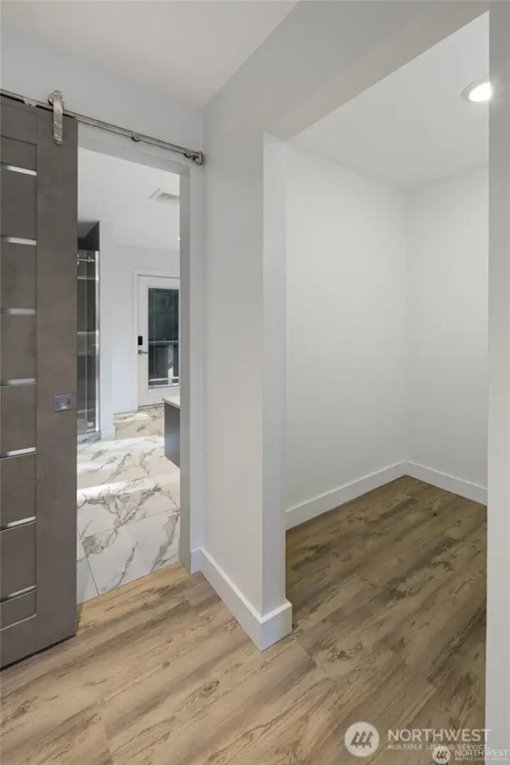 Thoughtful bedroom design includes convenient closet space, modern barn-style doors, and easy access to the updated spa-inspired bath. Thoughtful bedroom design includes convenient closet space, modern barn-style doors, and easy access to the updated spa-inspired bath.
