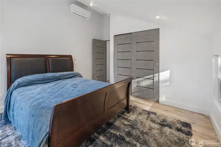 This inviting bedroom offers clean lines, updated flooring, contemporary doors, and efficient ductless heating and cooling for year-round Lopez Island comfort. This inviting bedroom offers clean lines, updated flooring, contemporary doors, and efficient ductless heating and cooling for year-round Lopez Island comfort.