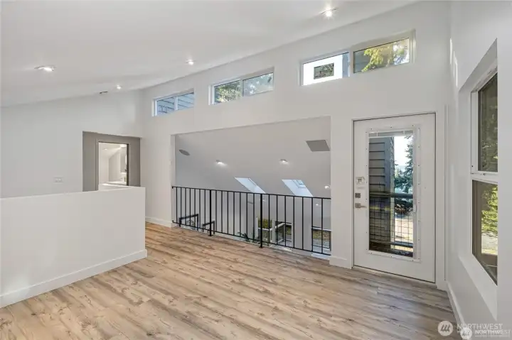 Freshly remodeled interiors feature vaulted ceilings, clerestory windows, engineered hardwood floors, and abundant natural light for a bright contemporary island feel. Freshly remodeled interiors feature vaulted ceilings, clerestory windows, engineered hardwood floors, and abundant natural light for a bright contemporary island feel.