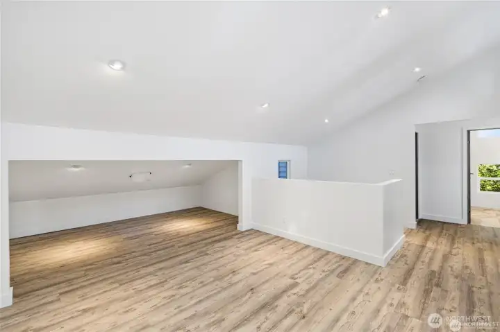 A bright upstairs flex area offers room for an office, media space, studio, or guest overflow within this remodeled Lopez Island home. A bright upstairs flex area offers room for an office, media space, studio, or guest overflow within this remodeled Lopez Island home.
