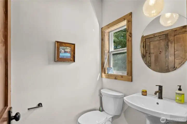 Main Floor Powder Room adjacent to the sitting room. Main Floor Powder Room adjacent to the sitting room.