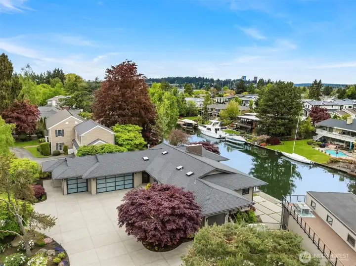Welcome to 61 Cascade Key - where life on the water begins. An exceptional Newport Shores residence with expansive frontage, a fully rebuilt boathouse, and rooftop deck overlooking the canal.