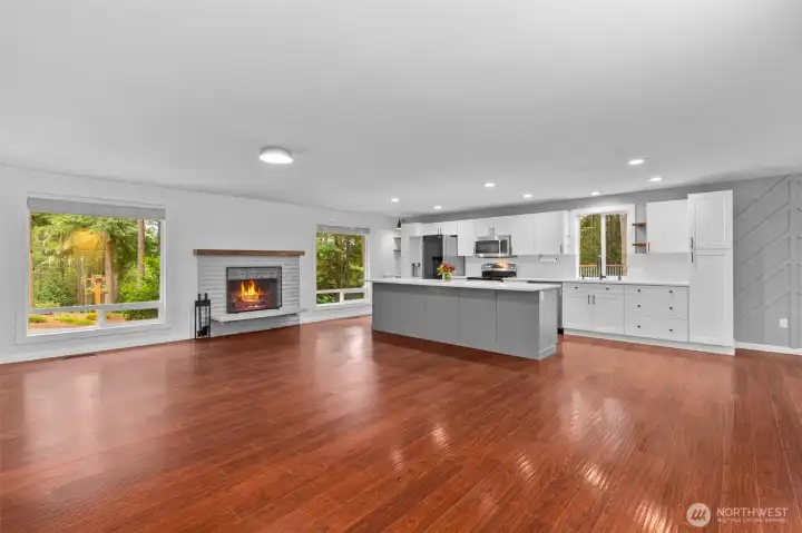 Large windows and wood burning fireplace