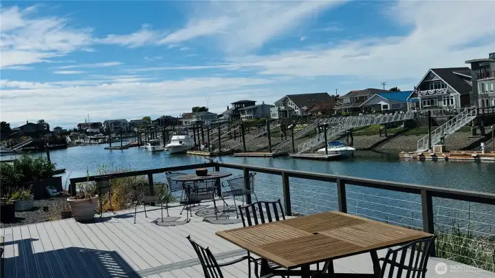 The main leve has a huge open shared deck and has a gate to walk down to the beach on the channel. The main leve has a huge open shared deck and has a gate to walk down to the beach on the channel.