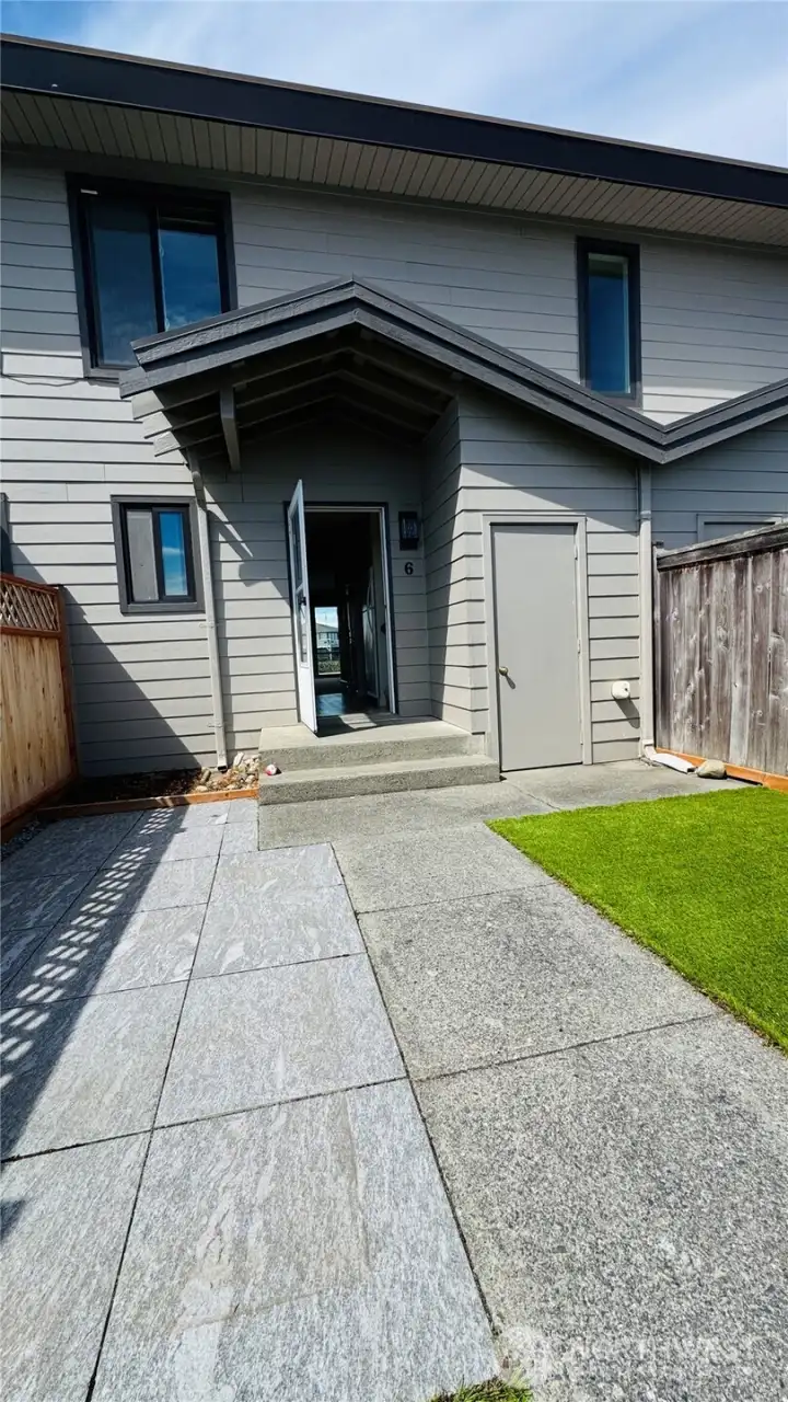 Private townhome courtyard entry, and a smaller second unit storage closet to the right. Private townhome courtyard entry, and a smaller second unit storage closet to the right.