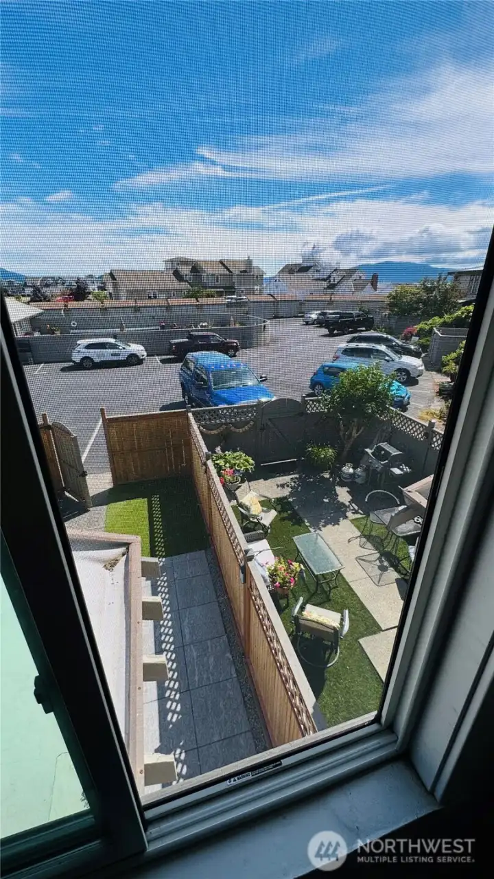 This photo is taaken from the upstairs 2nd bedroom and shows the unit courtyard on the left, and your neighbors lovely courtyard on the right... This photo is taaken from the upstairs 2nd bedroom and shows the unit courtyard on the left, and your neighbors lovely courtyard on the right...