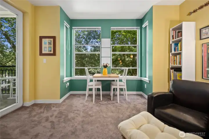 Bright living space with large windows and room for dining nearby. Bright living space with large windows and room for dining nearby.