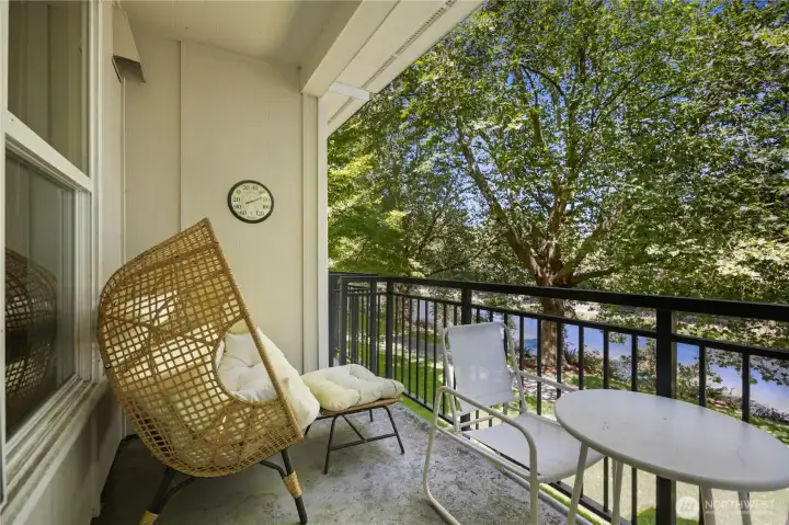Private balcony with leafy views and space for outdoor seating. Private balcony with leafy views and space for outdoor seating.