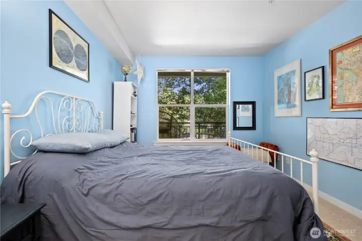Bright primary bedroom with a large window, leafy views, and space for comfortable everyday living. Bright primary bedroom with a large window, leafy views, and space for comfortable everyday living.