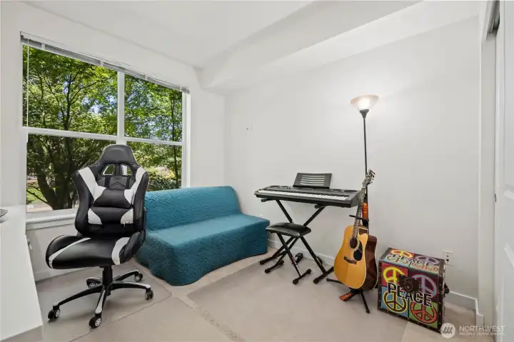 Bright secondary bedroom with natural light and flexible space for an office, guest room, or hobby area. Bright secondary bedroom with natural light and flexible space for an office, guest room, or hobby area.