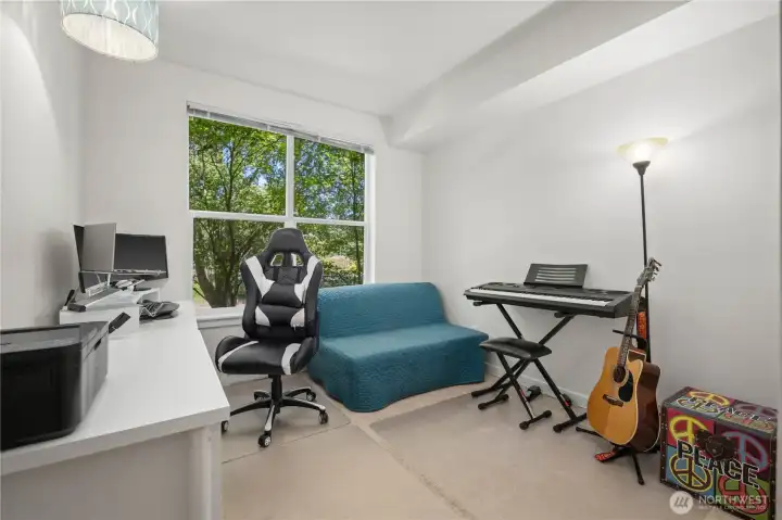 Bright secondary bedroom with natural light and flexible space for an office, guest room, or hobby area. Bright secondary bedroom with natural light and flexible space for an office, guest room, or hobby area.