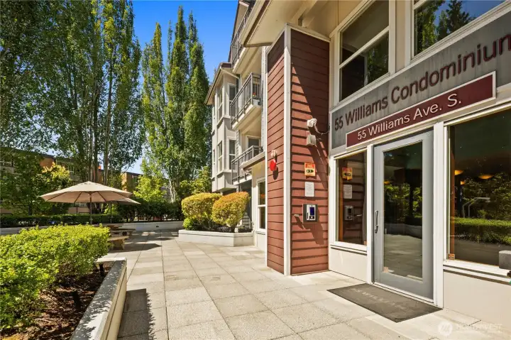 Main entrance to 55 Williams Condominiums and shared courtyard. Main entrance to 55 Williams Condominiums and shared courtyard.