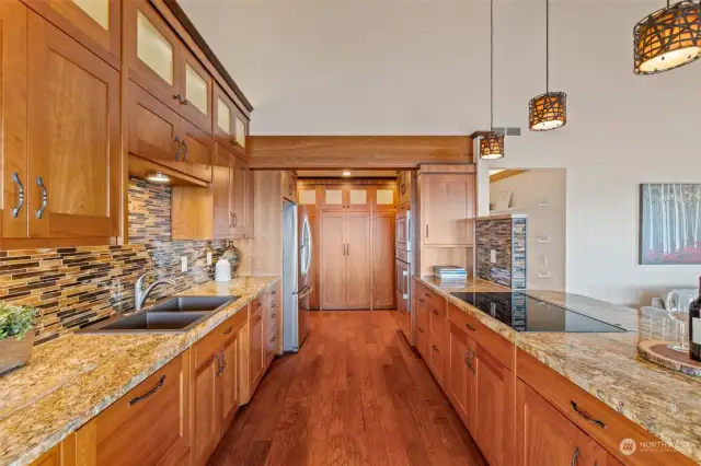 Luxurious features include a gourmet kitchen, custom built Brazilian cherry wood cabinets, with soft close drawers, granite countertops, stainless steel appliances, built-in dishwasher. The wall glass cabinets are illuminated so the space will look great day and night.