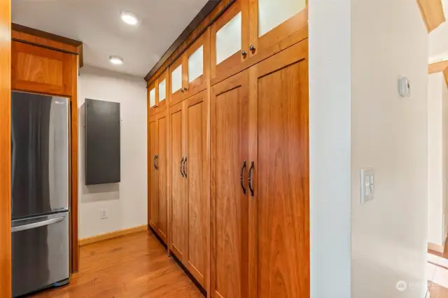 Large pantry area with slide out drawers.