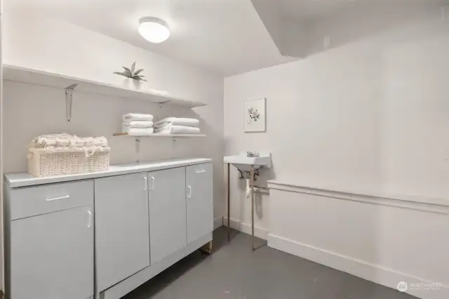 Storage room off to the left of this laundry room.