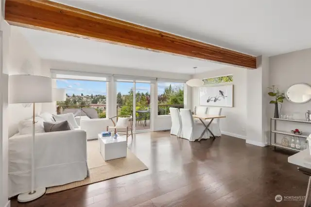 Main floor living area is open and bright. Off to the right near the console table, there used to be a spiral staircase that connected the units inside. Space still exists if the new owner wants to put one in!