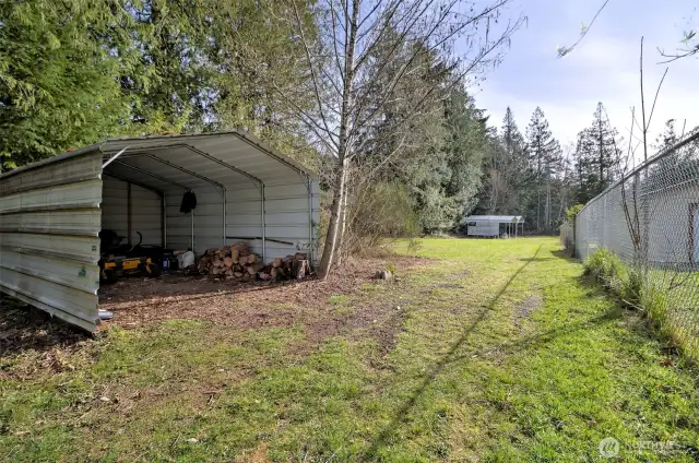 One of three metal carports that is included.