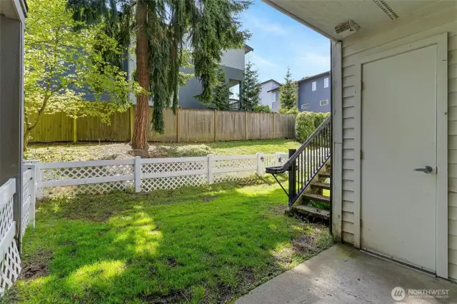 fenced backyard w/ storage closet