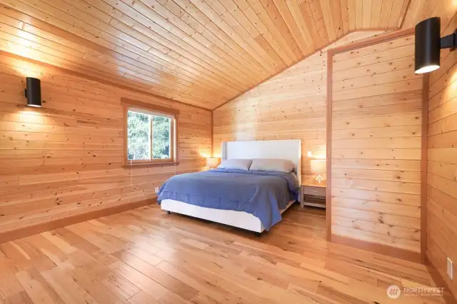 The primary bedroom w en suite is in the lofted 2nd floor. It features a vaulted ceilings, large sitting area, and a 3/4 bath.