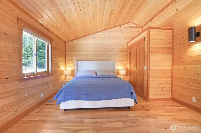 The primary bedroom w en suite is in the lofted 2nd floor. It features a vaulted ceilings, large sitting area, and a 3/4 bath.