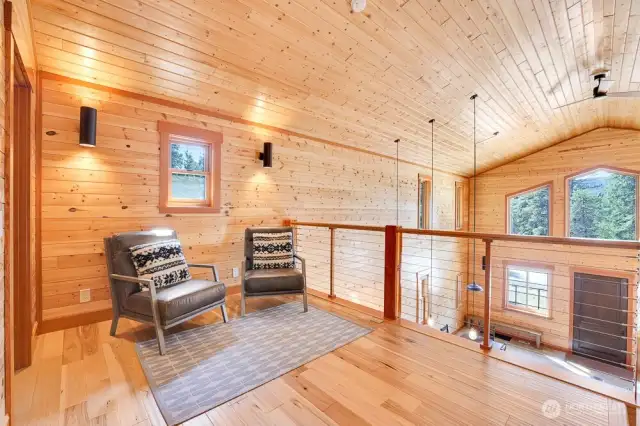 The primary bedroom w en suite is in the lofted 2nd floor. It features a vaulted ceilings, large sitting area, and a 3/4 bath.