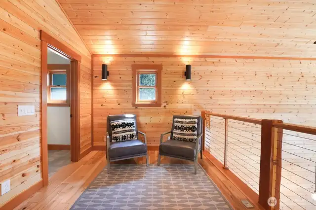 The primary bedroom w en suite is in the lofted 2nd floor. It features a vaulted ceilings, large sitting area, and a 3/4 bath.