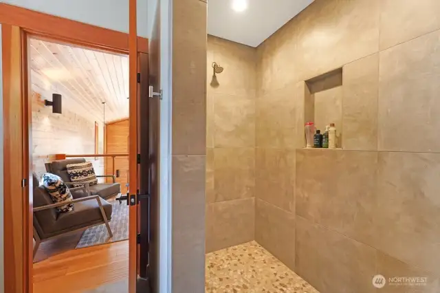 The primary bedroom w en suite is in the lofted 2nd floor. It features a vaulted ceilings, large sitting area, and a 3/4 bath.