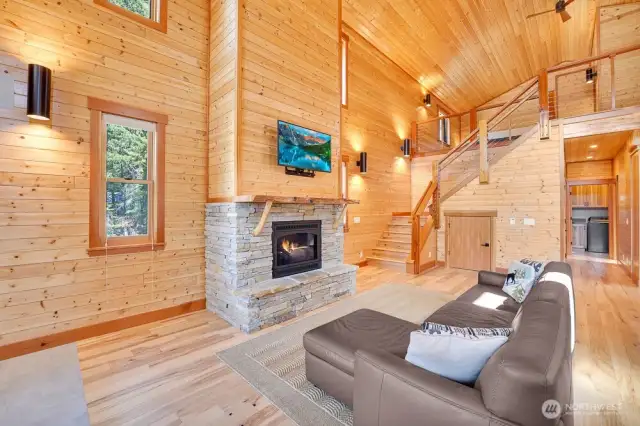 Soaring ceilings in the living with the lofted primary above.