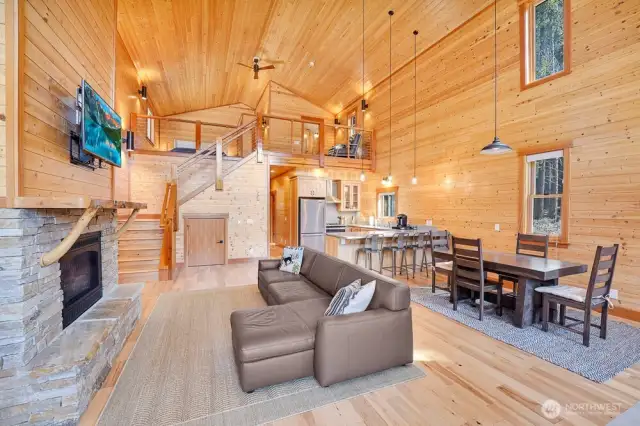 This property boasts rich wood finishes, soaring ceilings, and open-concept design.