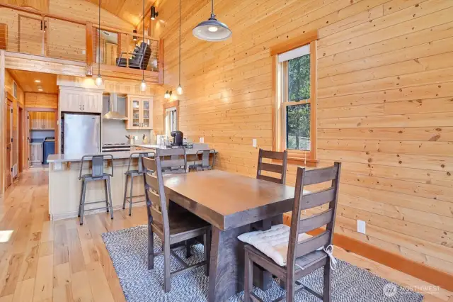 This property boasts rich wood finishes, soaring ceilings, and open-concept design.