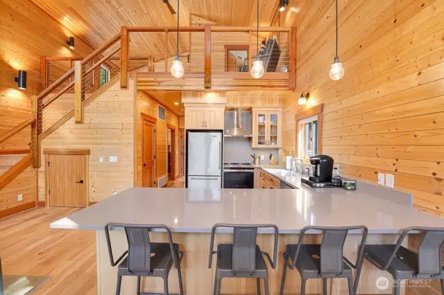 This property boasts rich wood finishes, soaring ceilings, and open-concept design.