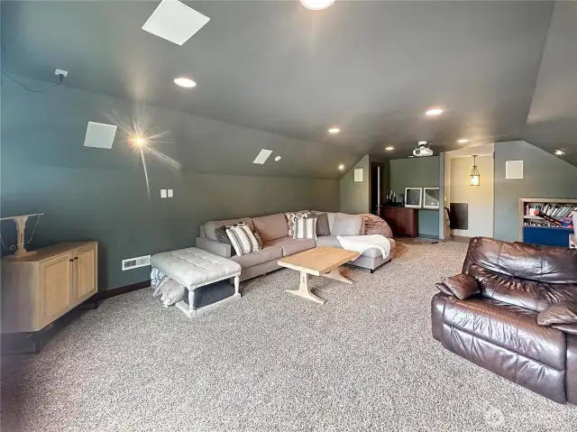 Media room also features a half bath, sink and cabinet.