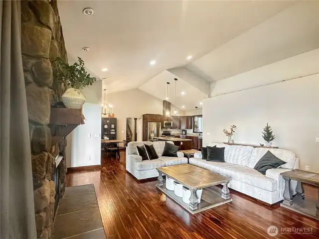 Soaring ceilings, wide-plank hardwood floors, and custom millwork set the tone for refined living.