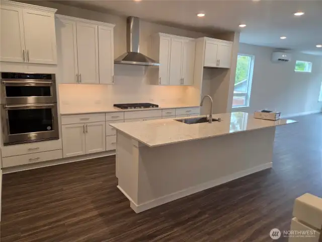 Kitchen with large island and Kitchen Aid appliances w/gas 5-burner cooktop