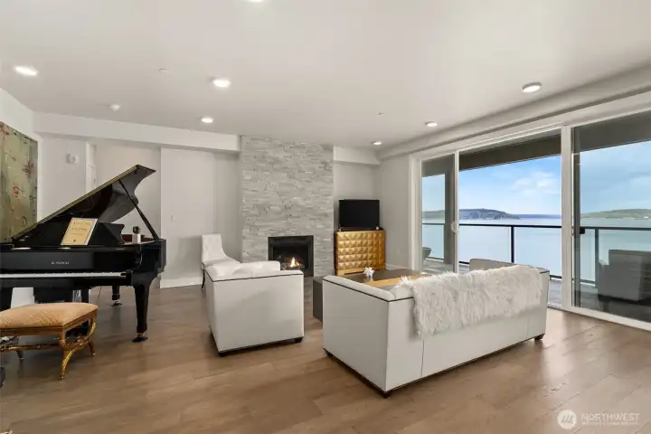 The gracious living area opens to your deck overlooking Vashon and Maury Islands.