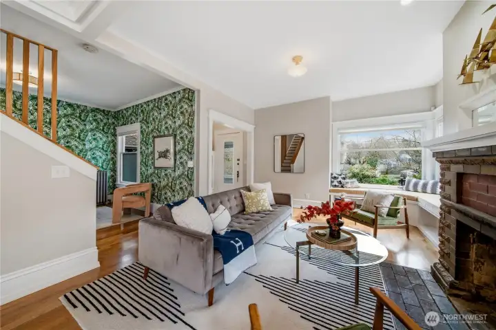 You're met with soaring ceilings and tons of natural light on the main level opening up