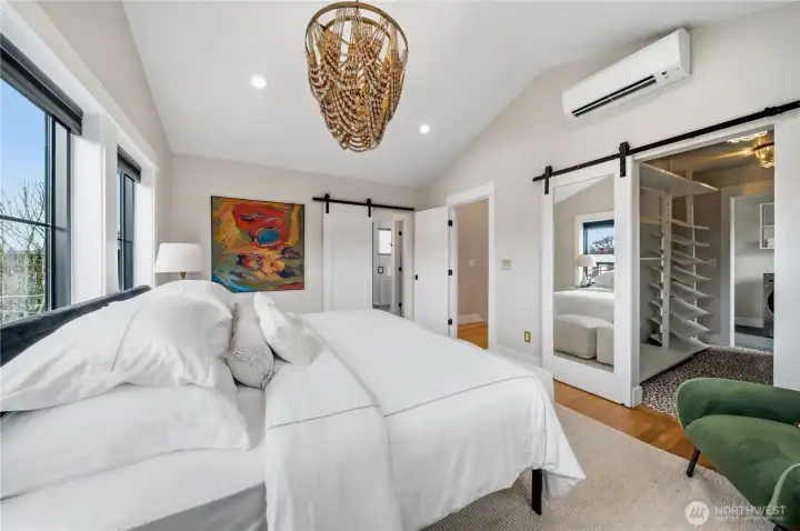 Enjoy a ton of light and AC in the luxurious primary bedroom.