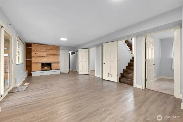 Downstairs bonus room, with 2 bedrooms. At the end of the hall there is a potential ADU that can be closed off with the hallway door