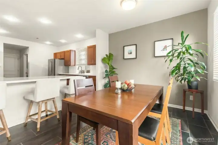 So functional! The dining area connects seamlessly to the kitchen with bar seating in between.