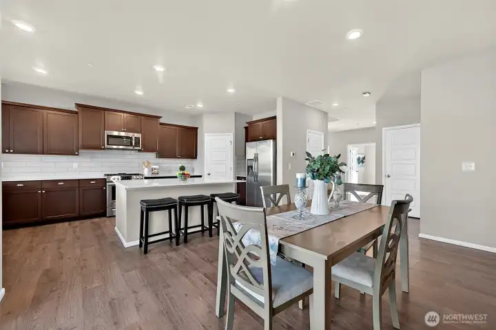 There is plenty of room for an even larger dining table in this expansive space