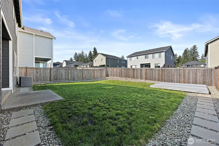 The back yard is level with room for gardening, and relaxing