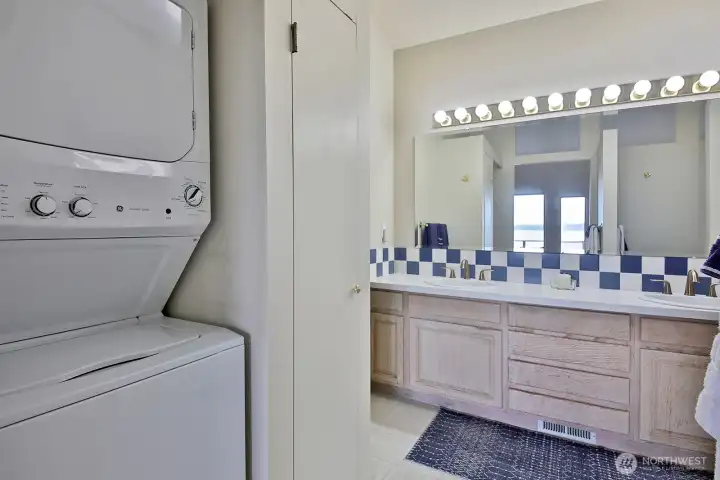 Double sinks and laundry just off the primary bedroom.