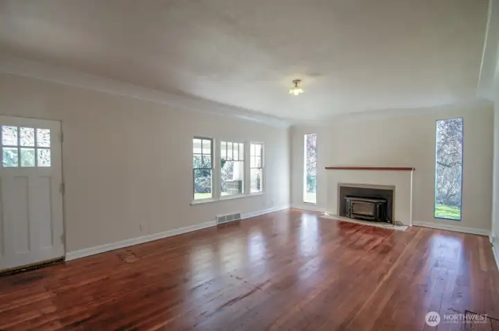 Large living room with original hardwood floors