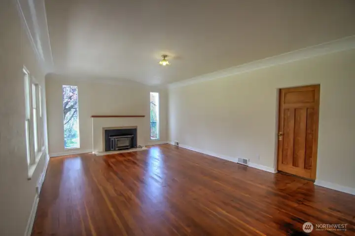 Large living room with original craftsman doors