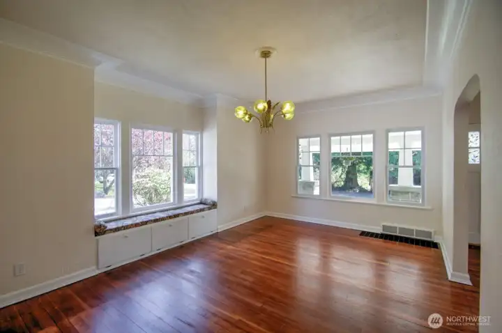 Large dining room with coved ceilings and plenty of natural light
