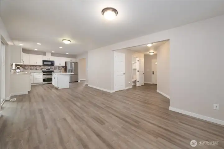 Main house: Living room, kitchen, and powder room on main floor.