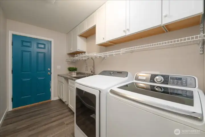 Main house: Utility room off garage on main floor.