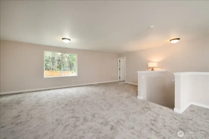 Main house: Upper level mezzanine with 4 bedrooms and a full bathroom.