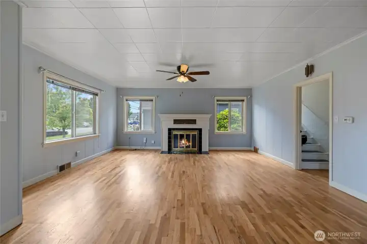 Gas insert - Flames in fireplace is virtually staged - Wonderful original mantel with tile surround.